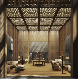 gemütliche lounge in der lobby des luxushotels in china mit viel holz und gemütlichen sitzmöbeln in warmen stofftönen