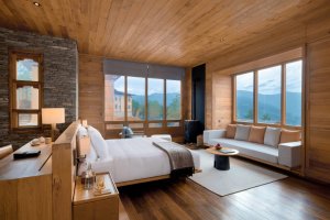wunderschönes schlafzimmer mit ausblick auf die berge in der luxus lodge von six senses in bhutan